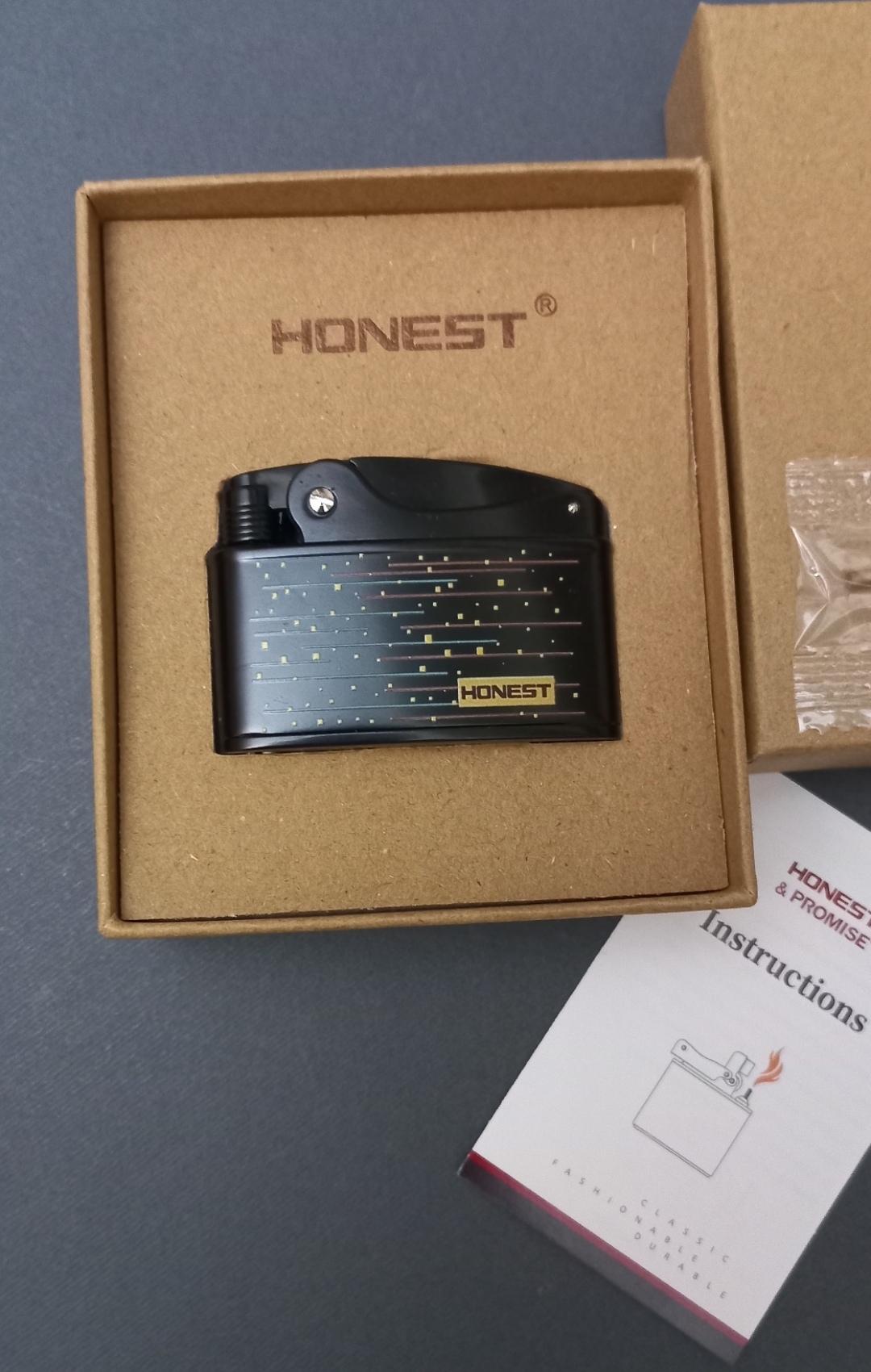 فندک بنزینی طرح رانسون وارفلیم برند هانست HONEST
